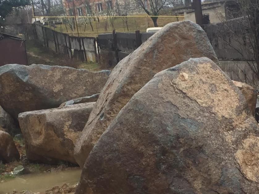 Armor stone stockpiled for coastal reinforcement works